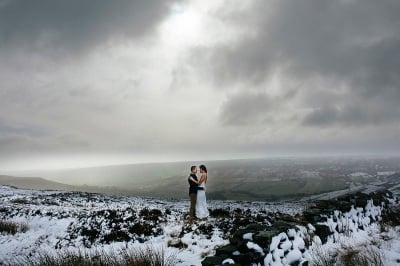 Bride and Groom eloping in the snow